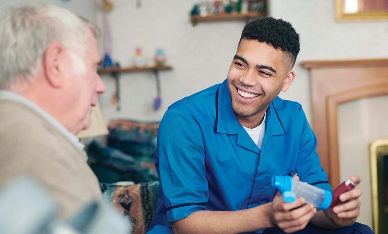 A nurse with an older gentleman