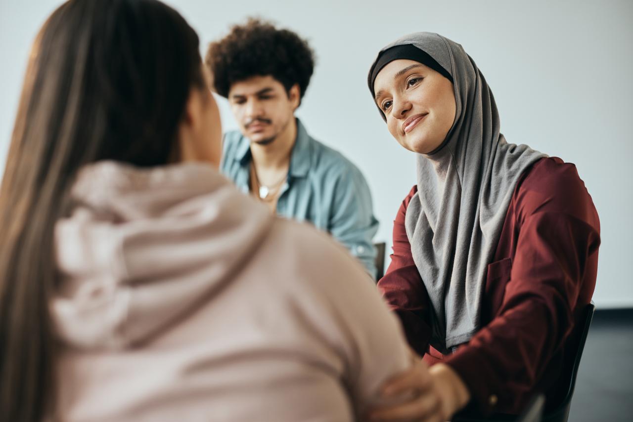 woman encouraging her female friend who is talking about mental health