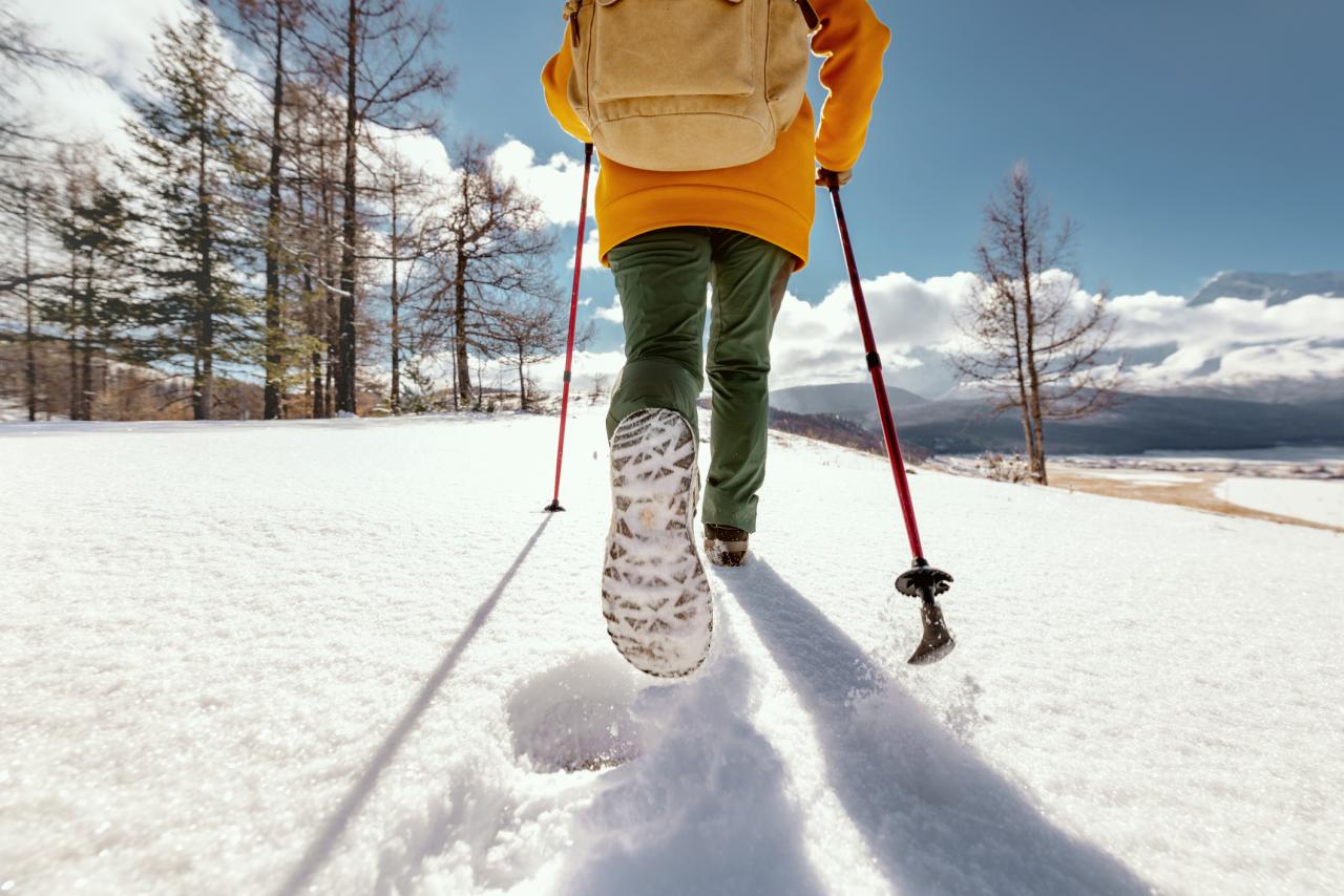 woman walking in deep snow