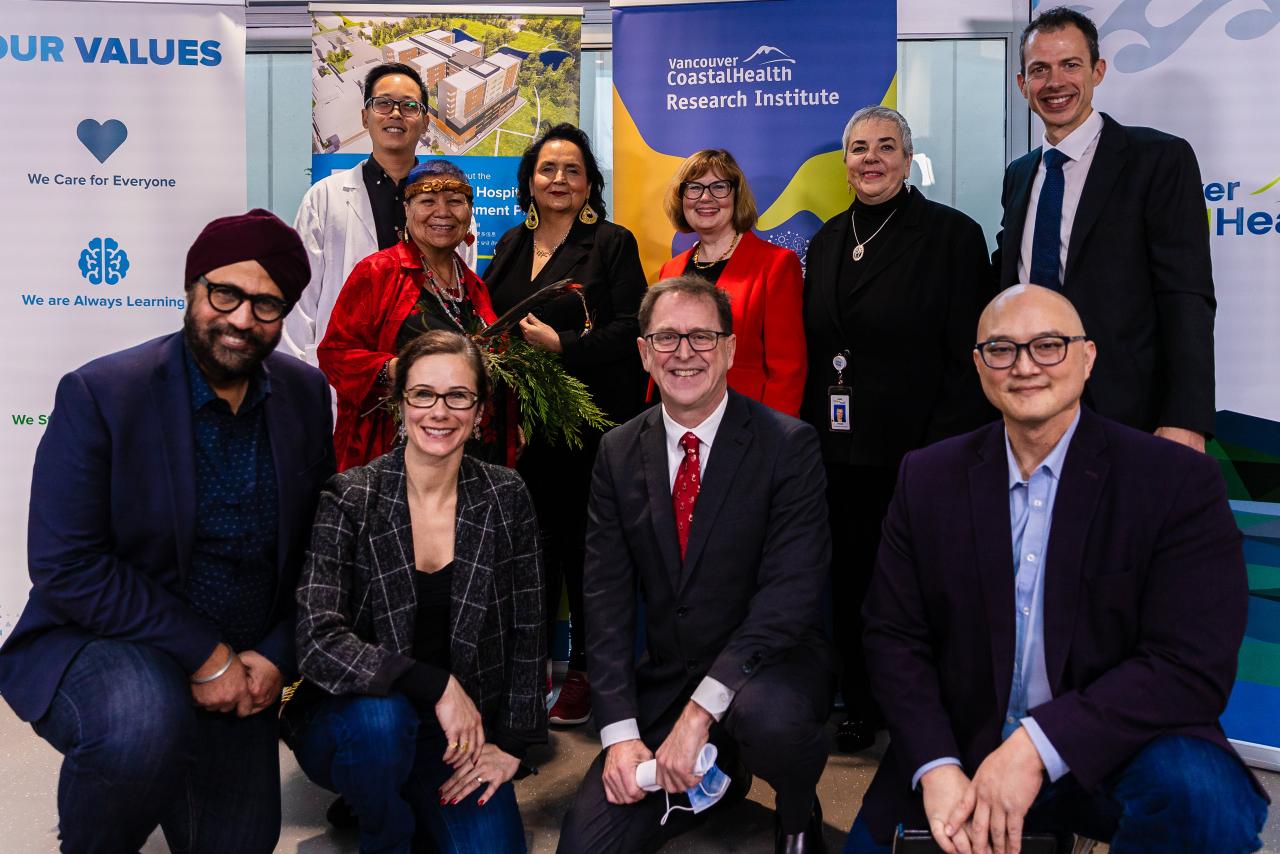 Project members pose during announcement of Cancer Care Clinic completion