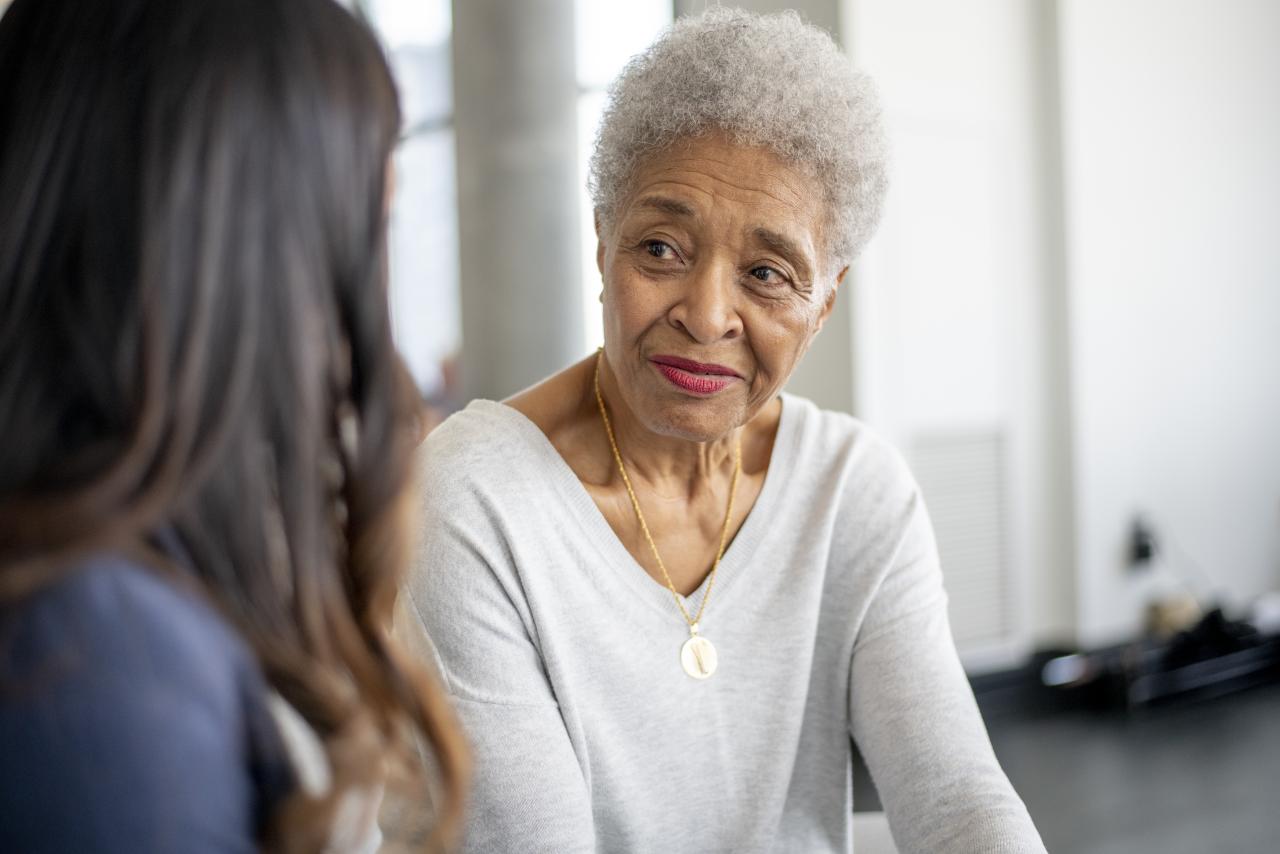 senior woman speaking to a physician