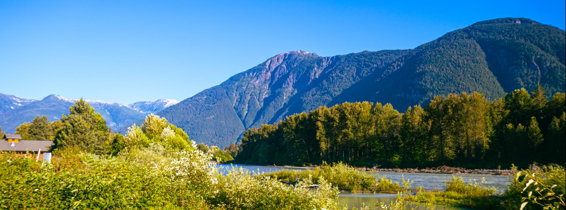 Landscape of Bella Coola with mountains in background.