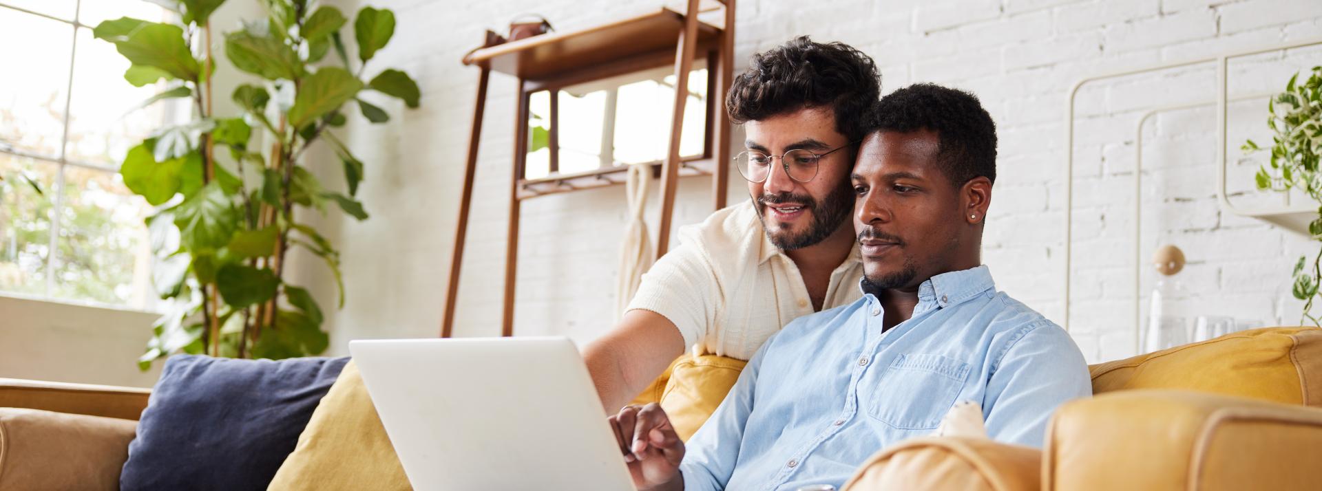 Couple looking at laptop together