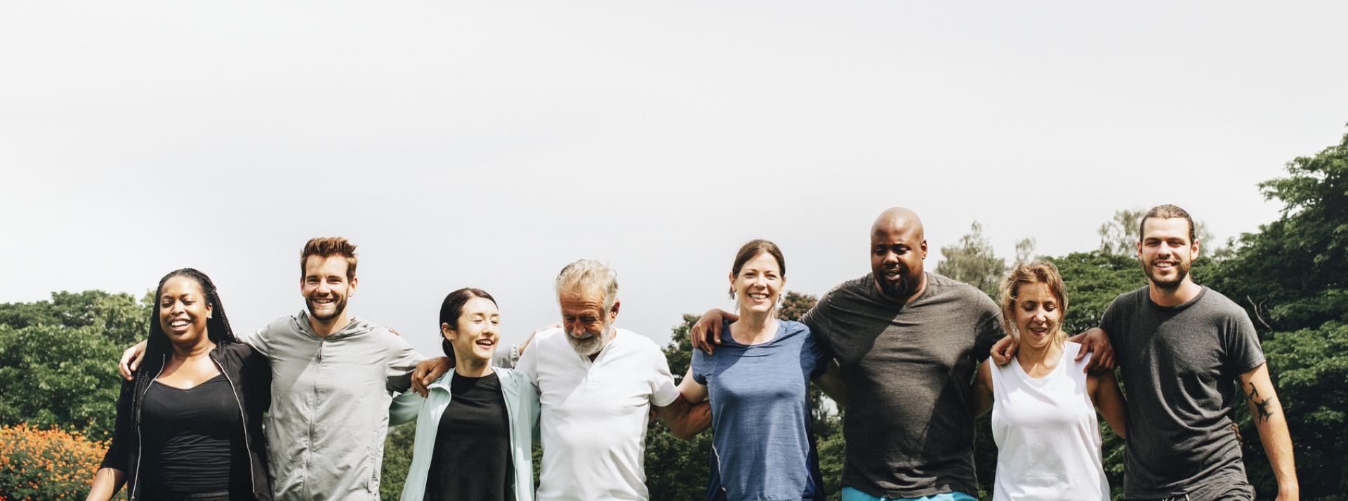 Group of people standing next to each other.