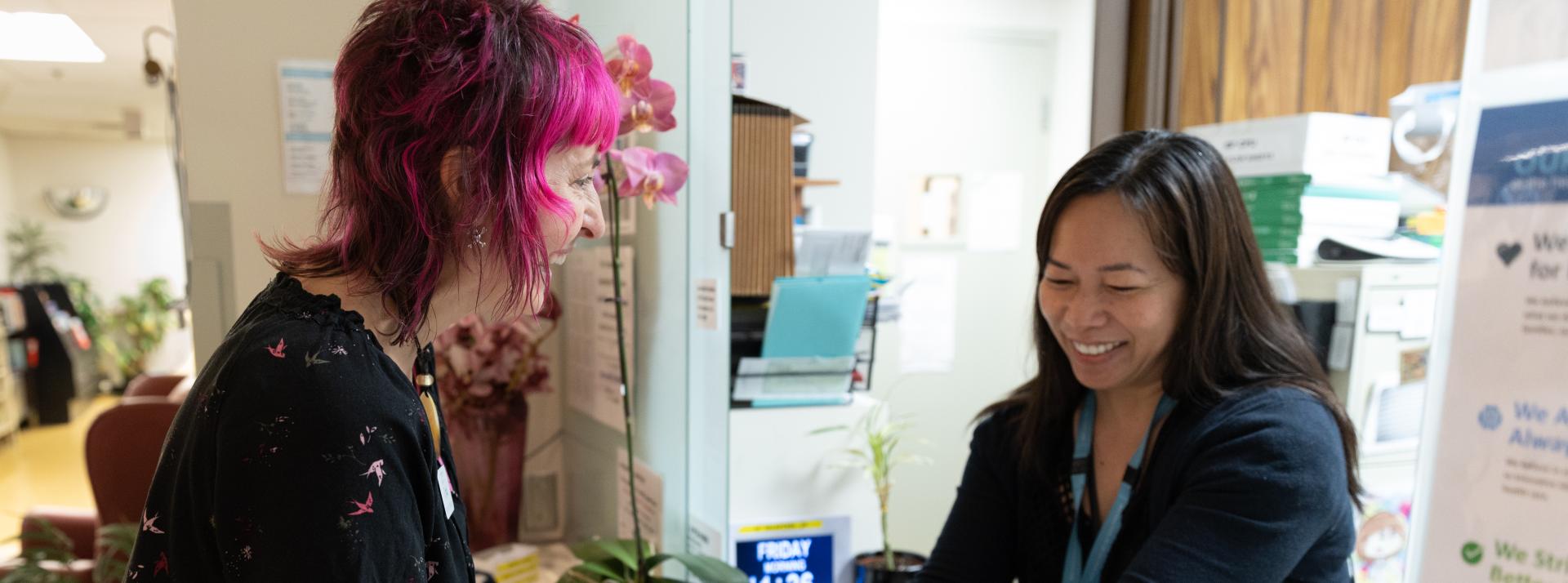 Recreation Therapist talking to staff member