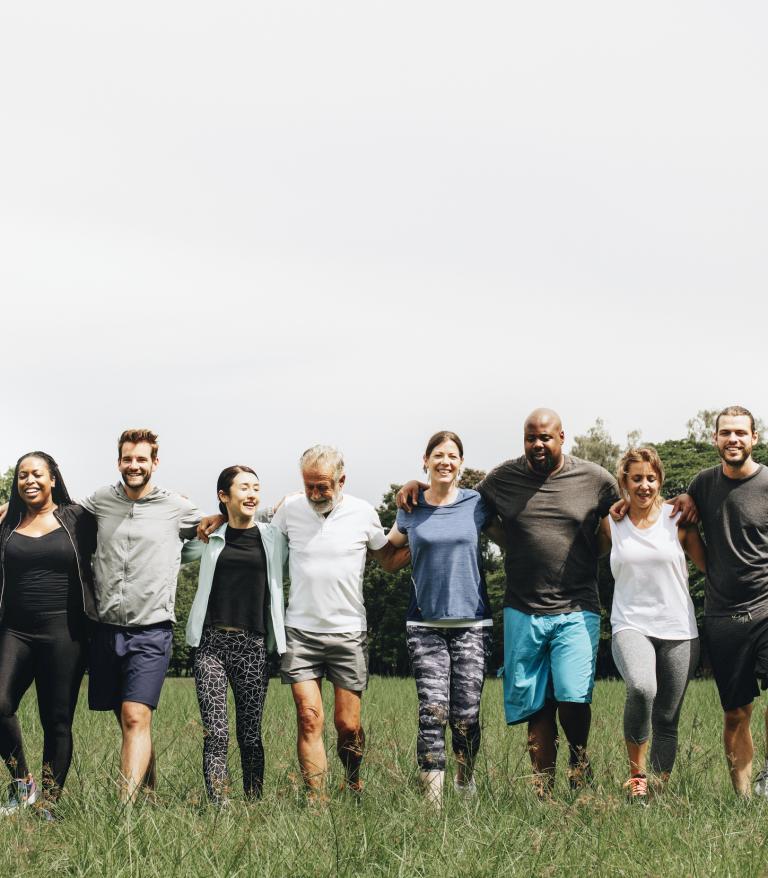 Group of people standing next to each other.