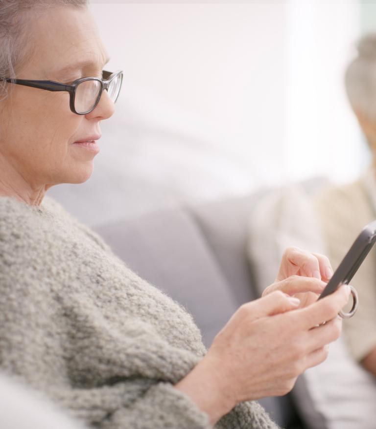 Two women on mobile devices