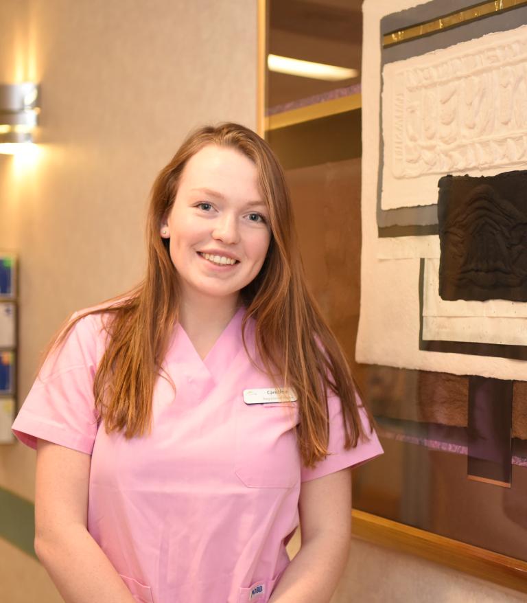 Caroline Frankfurter, RN, standing in a VCH facility.