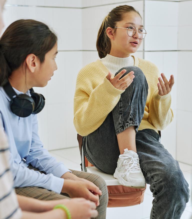 A teen discusses mental health with a group