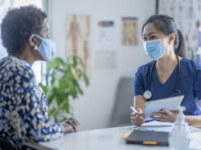 Doctor meeting with patient.