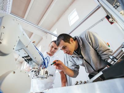 Mechanics on a robotic arm.