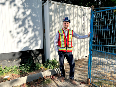 men in front of fence