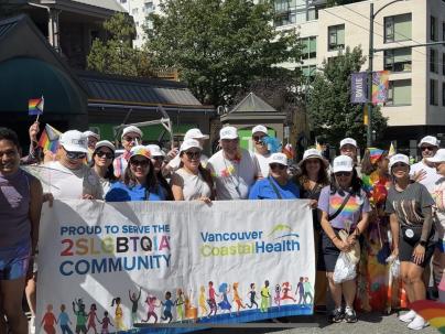 VCH employees posing for a group photo before the 2024 Vancouver pride parade